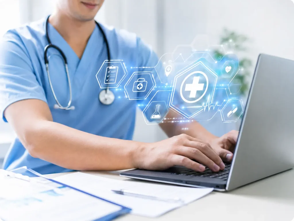 Healthcare professional using laptop with medical technology interface